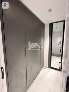 Elegant 4-Bedroom Apartment with Balcony Image 9