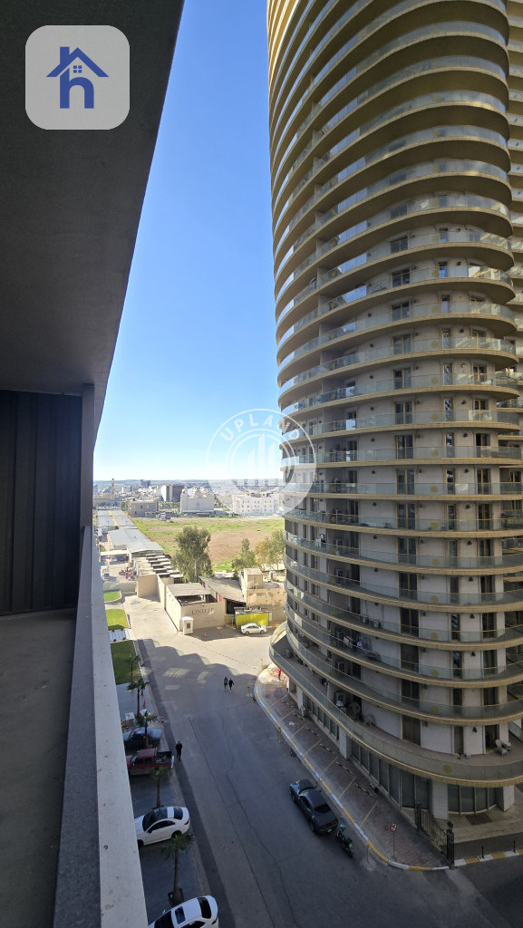 شوقەیەکی مۆدێرن یەک ژووری نوستن لە ڕامی تاوەر وێنە 16