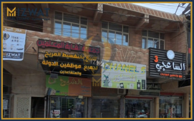 مبنى تجاري واسع مع 5 محلات صورة 3