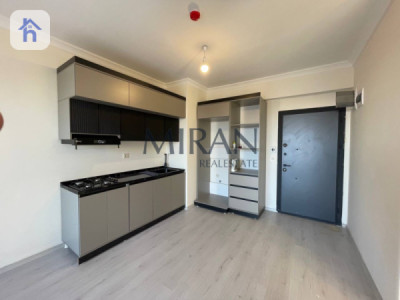 شوقەیەکی ئارام لەگەڵ ژووری میوانێکی فراوان image 2