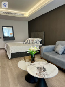 شوقەیەکی ستۆدیۆیی لوکس لە تاوەرێکی بەرز وێنە 5