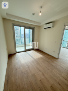 Cozy 1-Bedroom Apartment in Empire Wings Image 4