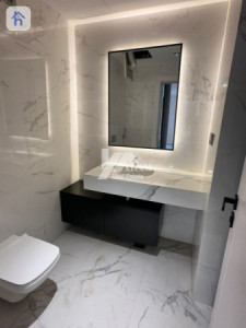 Elegant 4-Bedroom Apartment with Balcony Image 25