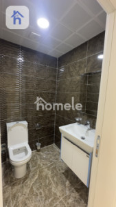 Cozy 3-Bedroom Apartment in Eskan Towers Image 8
