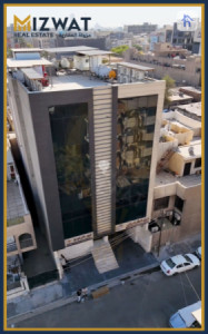 عقار تجاري بخمس طوابق في كرادة image 1