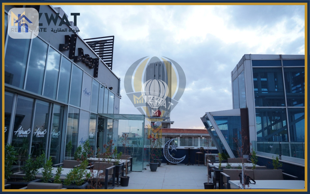 بینای بازرگانی لە جادریە وێنە 2